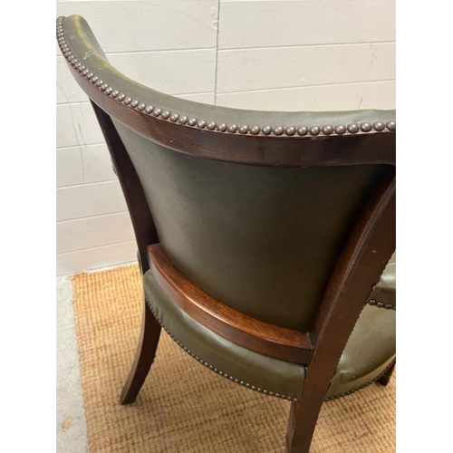 42 - A mahogany and leather desk chairs