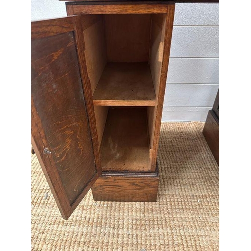 48 - An oak small or child's pedestal roll top desk, six drawers and single cupboards and chair   (H91cm ... 