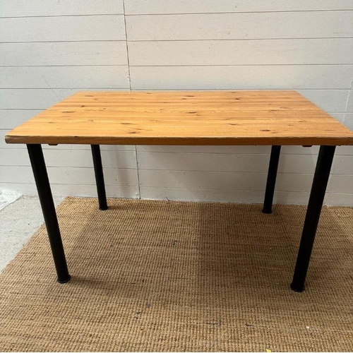 49 - A pine topped table on black metal legs (H73cm W120cm)