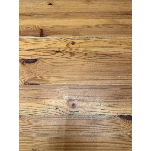 49 - A pine topped table on black metal legs (H73cm W120cm)