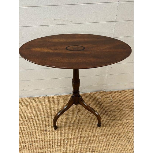 53 - An inlaid oval side table on down swept legs