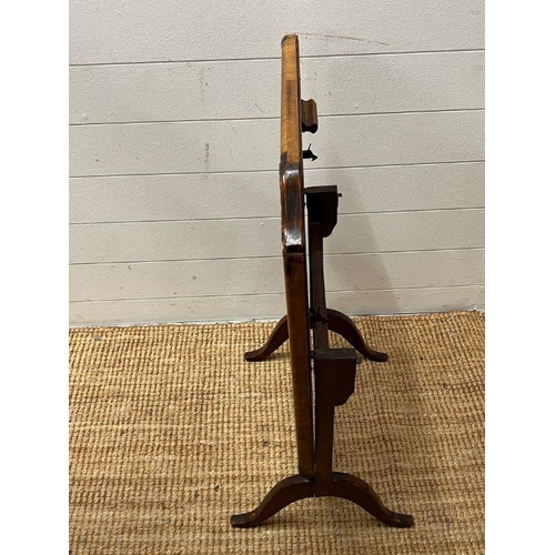 54 - A walnut framed fore screen with needle work to centre