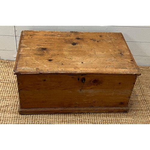 55 - A pine blanket box with iron hinges along with a selection of paper back books (H33cm W69cm D45cm)