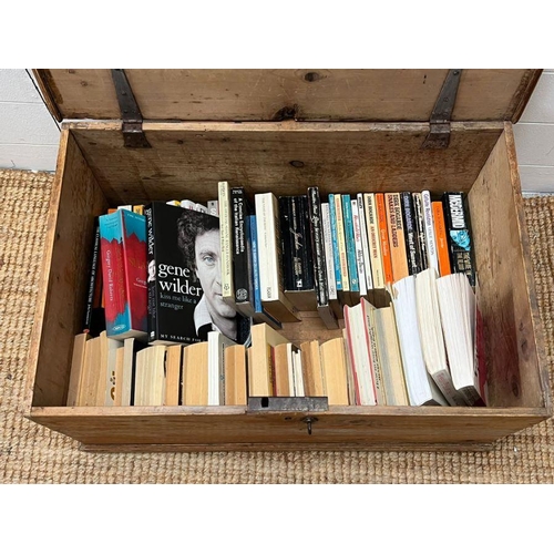 55 - A pine blanket box with iron hinges along with a selection of paper back books (H33cm W69cm D45cm)