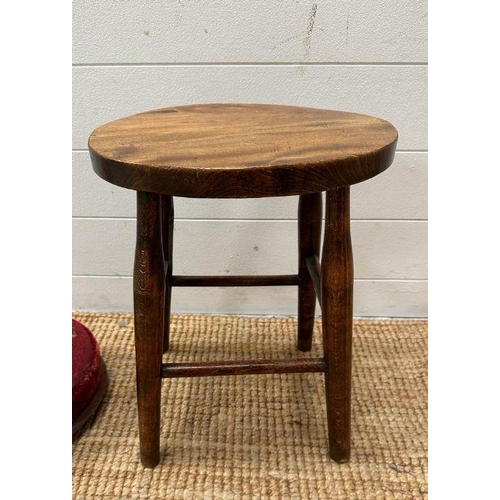 59 - A small oak stool and a red ground floral upholstered foot stool