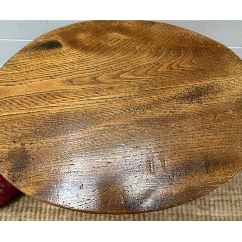 59 - A small oak stool and a red ground floral upholstered foot stool