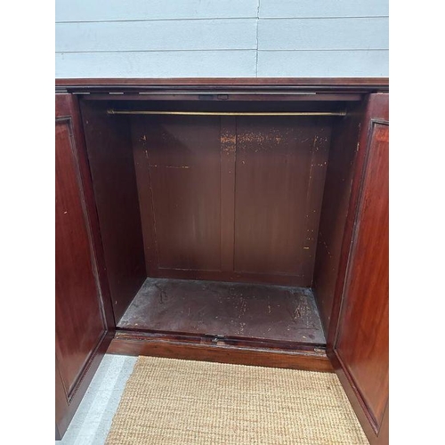 6 - A mahogany gentleman's wardrobe with fruitwood inlay, central doors leading to cupboard with hanging... 