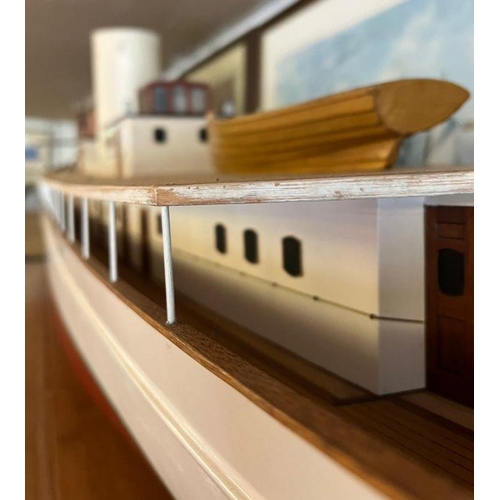 614 - A wooden very large long luxury steam yacht 