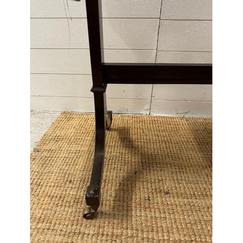 7 - A mahogany drop leaf occasional table on splayed legs with castors (H 73cm x D 51cm x W108cm)