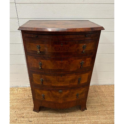 9 - A bow fronted caddy topped chest of four drawers (H 85cm x D 49cm x 61cm)