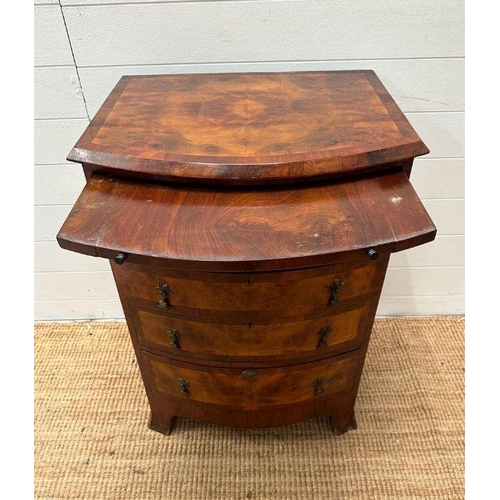 9 - A bow fronted caddy topped chest of four drawers (H 85cm x D 49cm x 61cm)