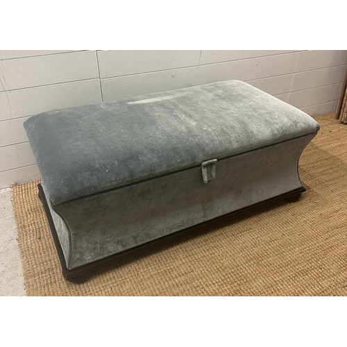 103 - A contemporary ottoman upholstered in grey velour (H43cm D55cm W106cm)