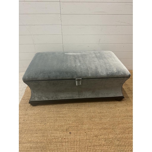 103 - A contemporary ottoman upholstered in grey velour (H43cm D55cm W106cm)