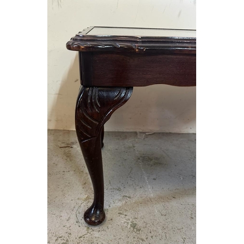 117 - A mahogany glass topped coffee table on cabriole legs and bun feet (H43cm D47cm W97cm)