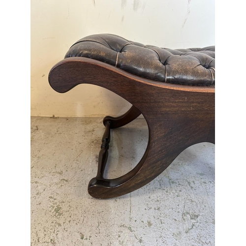 123 - A Regency style brown leather saddle seat (H40cm W68cm D44cm)