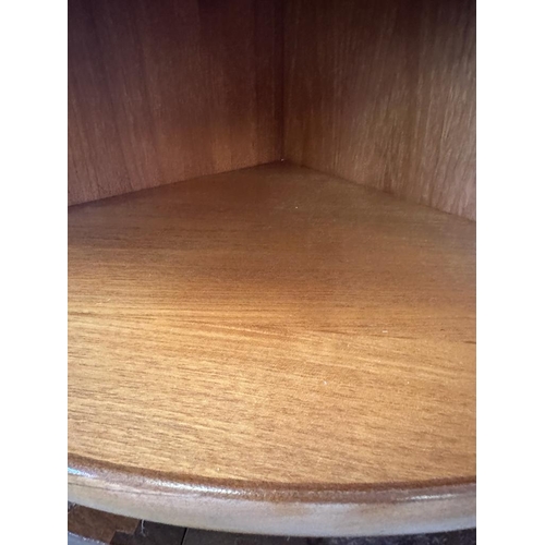 129 - A pair of Nathan teak corner units with single shelf and cupboard under (H75cm W62cm D45cm)