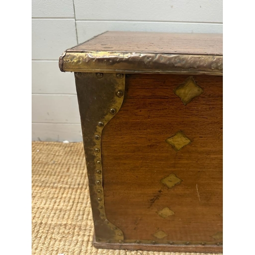 140 - An oak 19th Century Indonesia brass banded blanket box with brass drop handles (H44cm W83cm D43cm)