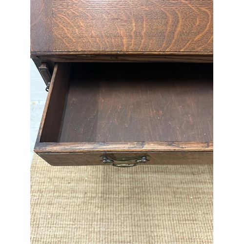 148 - An oak bureau on barley twist support and cross stretcher with single drawer and brass drop handles ... 