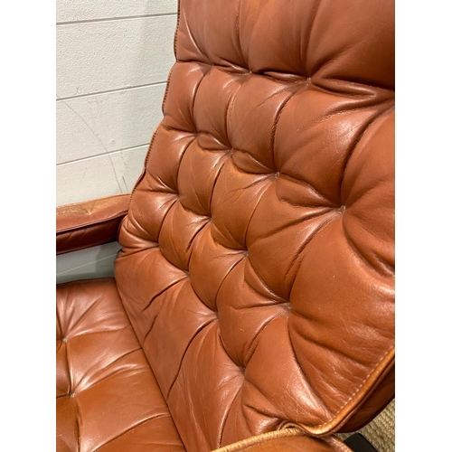 152 - A Scandinavian mid century reclining chair in brown leather