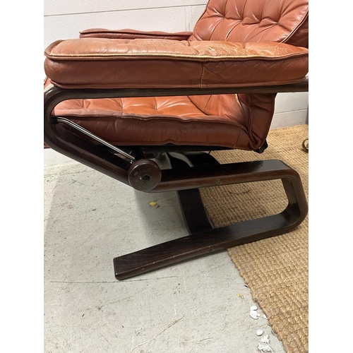 152 - A Scandinavian mid century reclining chair in brown leather