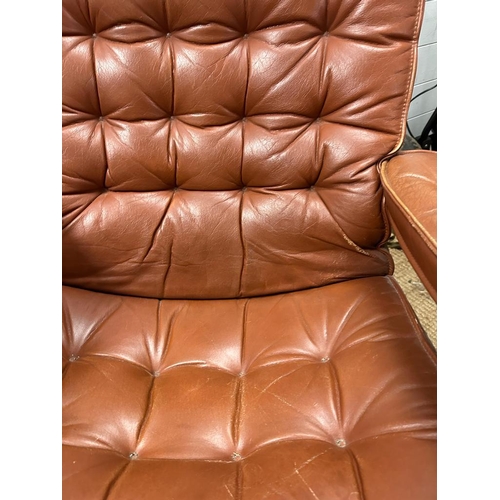 152 - A Scandinavian mid century reclining chair in brown leather