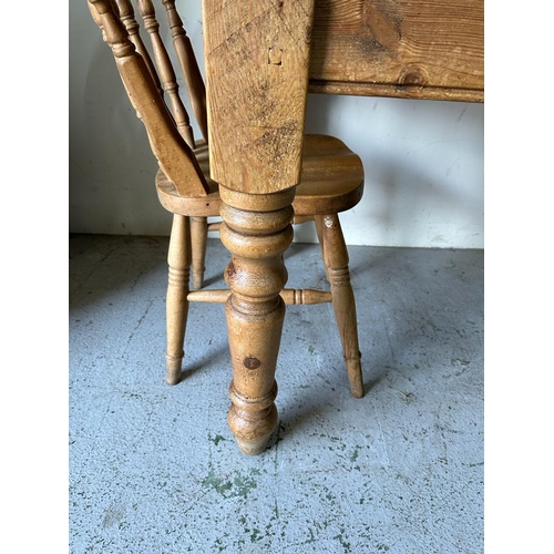 157 - A pine kitchen table with four chairs (H78cm W152cm D88cm)