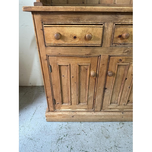 158 - A pine two cupboard and two door dresser with glazed cupboard over (H201cm W91cm D50cm)