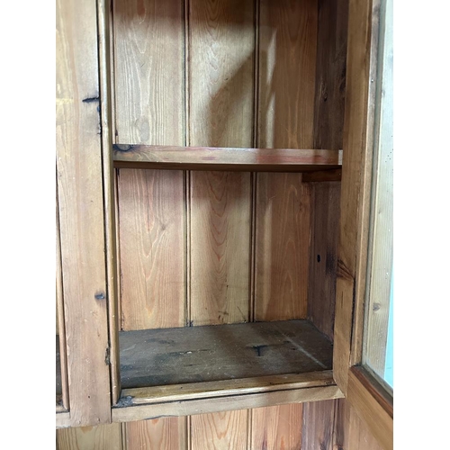 158 - A pine two cupboard and two door dresser with glazed cupboard over (H201cm W91cm D50cm)