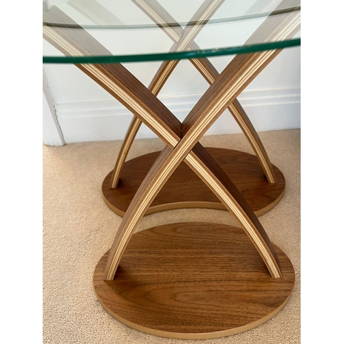 174 - A pair of nesting tables with oval glass and cross frame (H57cm W60cm D44cm)