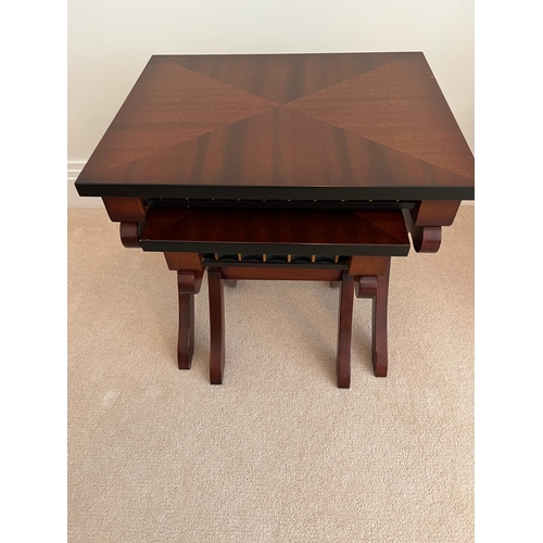 177 - A pair of nesting reproduction tables on cross supports (H44cm E45cm D36cm)