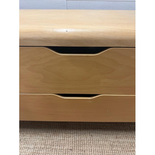 18 - A contemporary light wood two drawer chest of drawers (H68cm W130cm D49cm)