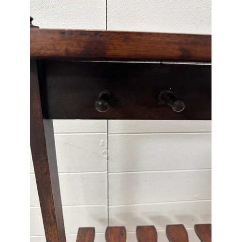 204 - A Georgian style mahogany double sided boot rack