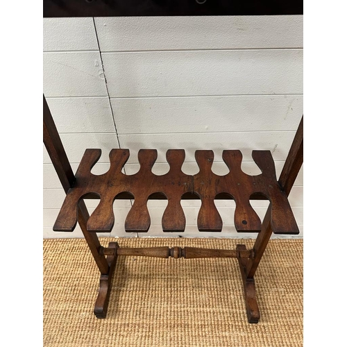 204 - A Georgian style mahogany double sided boot rack