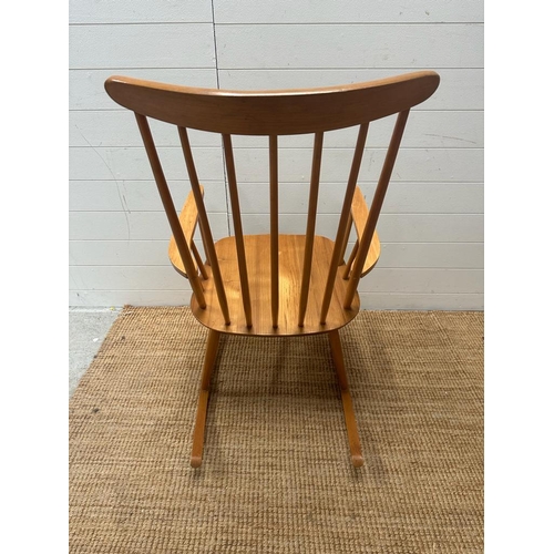 206 - A Mid Century teak Windsor stick back rocking chair