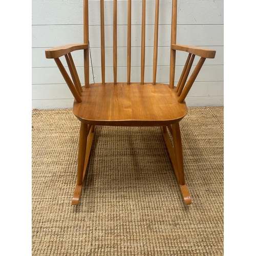 206 - A Mid Century teak Windsor stick back rocking chair