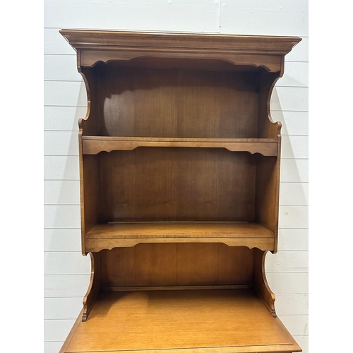 211 - A kitchen dresser comprising of two shelves and two drawers and two cupboards under (H197cm W91cm D4... 