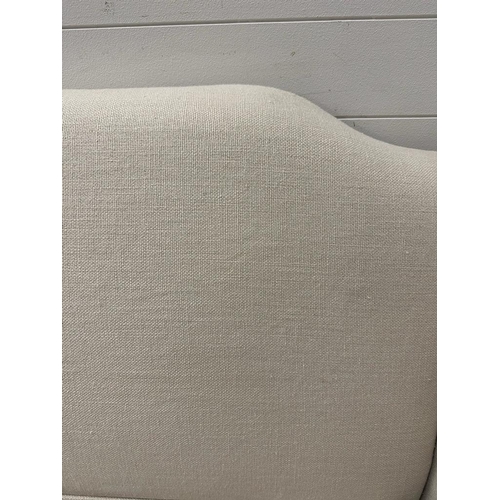 216 - A white linen upholstered two seat sofa by Neptune (W173cm)