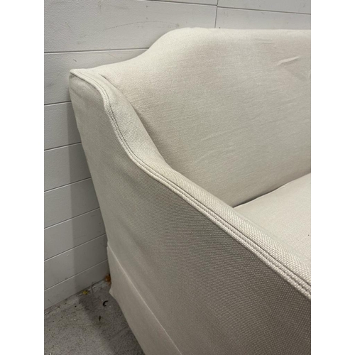 216 - A white linen upholstered two seat sofa by Neptune (W173cm)