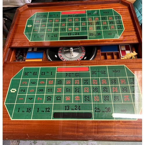 218 - An Italian inlaid games table with roulette, chest and including games pieces