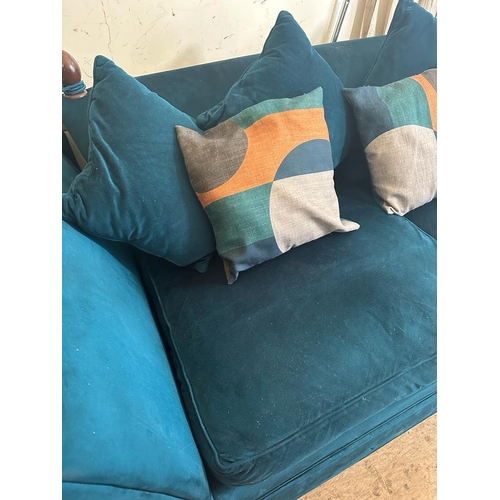 22 - A peacock blue upholstered drop end sofa (W216cm D100cm H78cm)