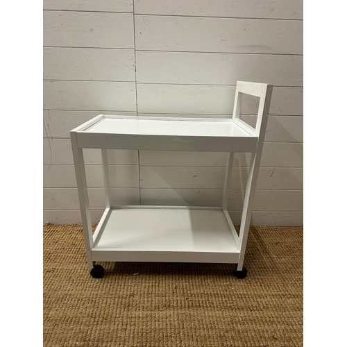 221 - A cotemporary white tea trolley on castors (H74cm D35cm W60cm)