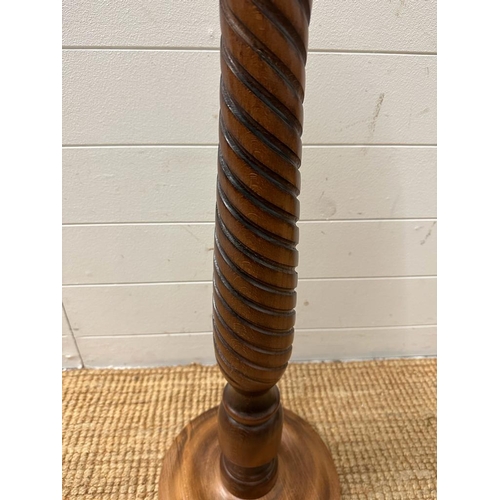 223 - A mahogany plant stand on turned central column (H93cm Dia26cm)