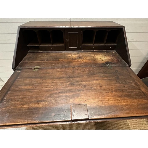 236 - An oak two over three bureau opening to four drawer, lockable cabinet and six storage compartments A... 