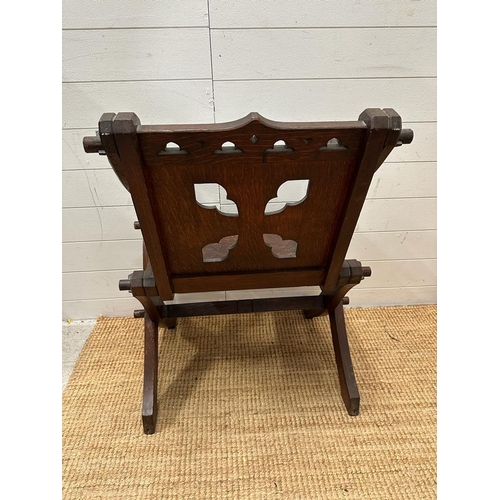 245 - An oak carved Glastonbury chair