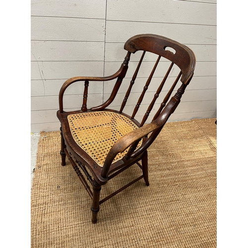 246 - A Victorian oak his and hers stick back chairs with cane seat s