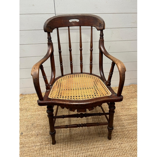 246 - A Victorian oak his and hers stick back chairs with cane seat s