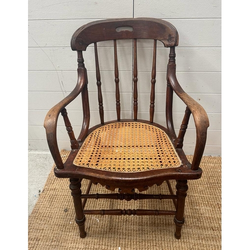 246 - A Victorian oak his and hers stick back chairs with cane seat s