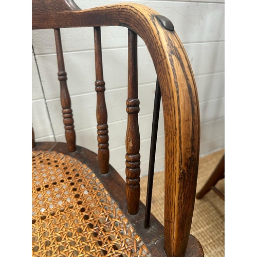 246 - A Victorian oak his and hers stick back chairs with cane seat s