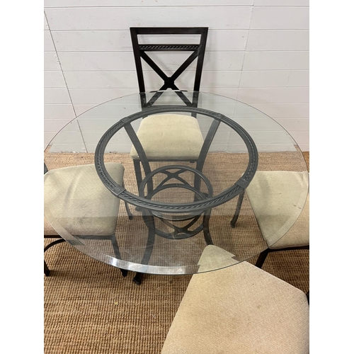 249 - A contemporary glass and metal dining table with four chairs (H75cm Dia114cm)