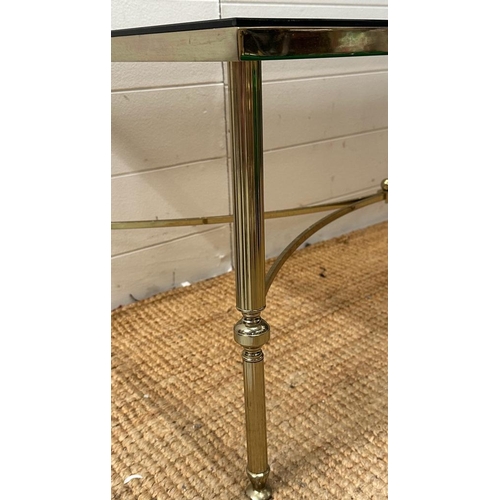 250 - A mid-century brass smoked glass topped coffee table. Height 42 and 45x90